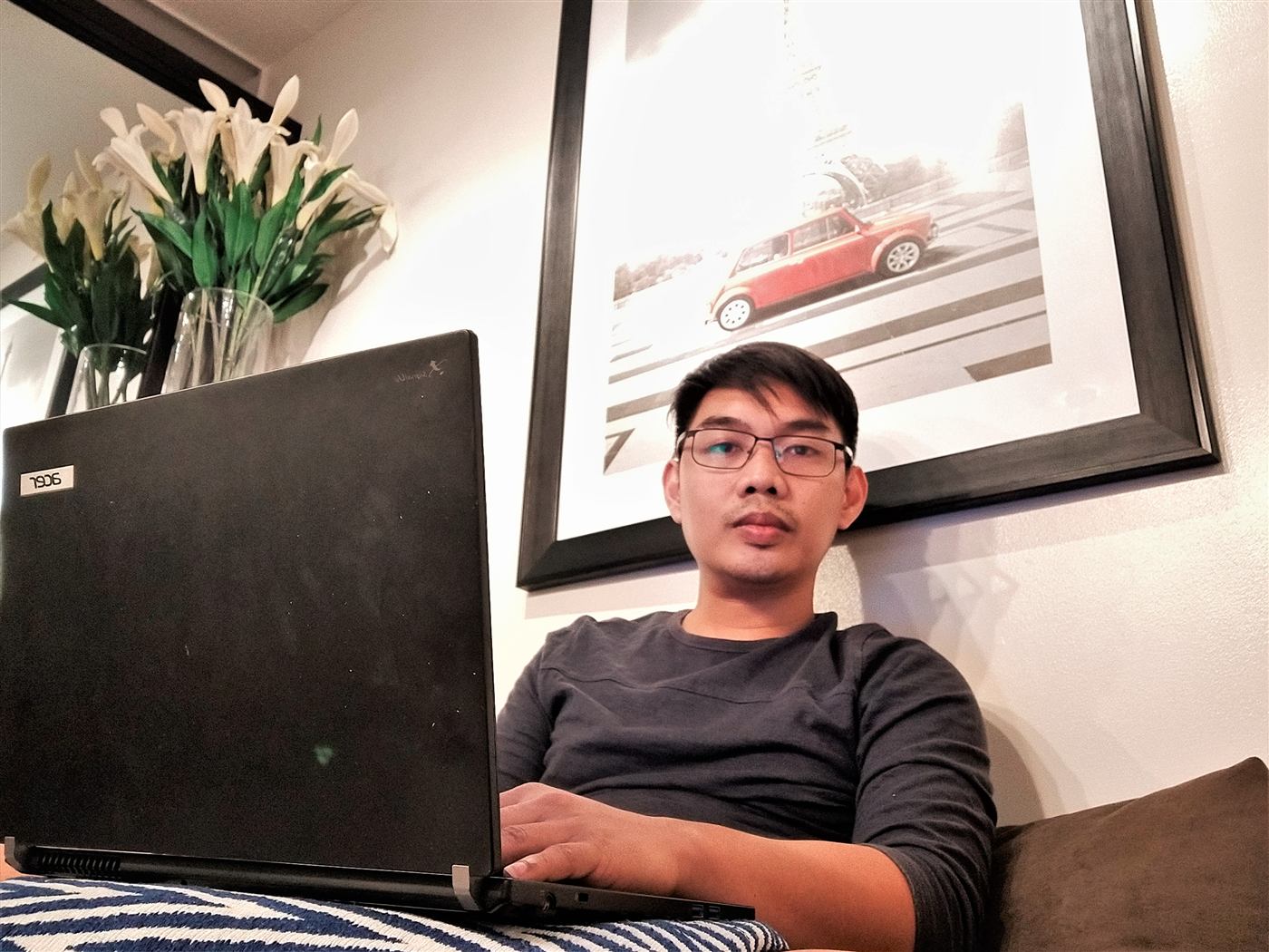 Jolas working on a laptop at home